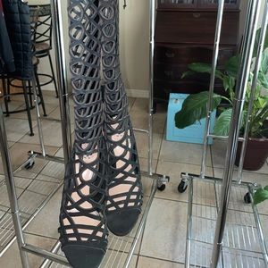 Opened toed black fishnet style boots